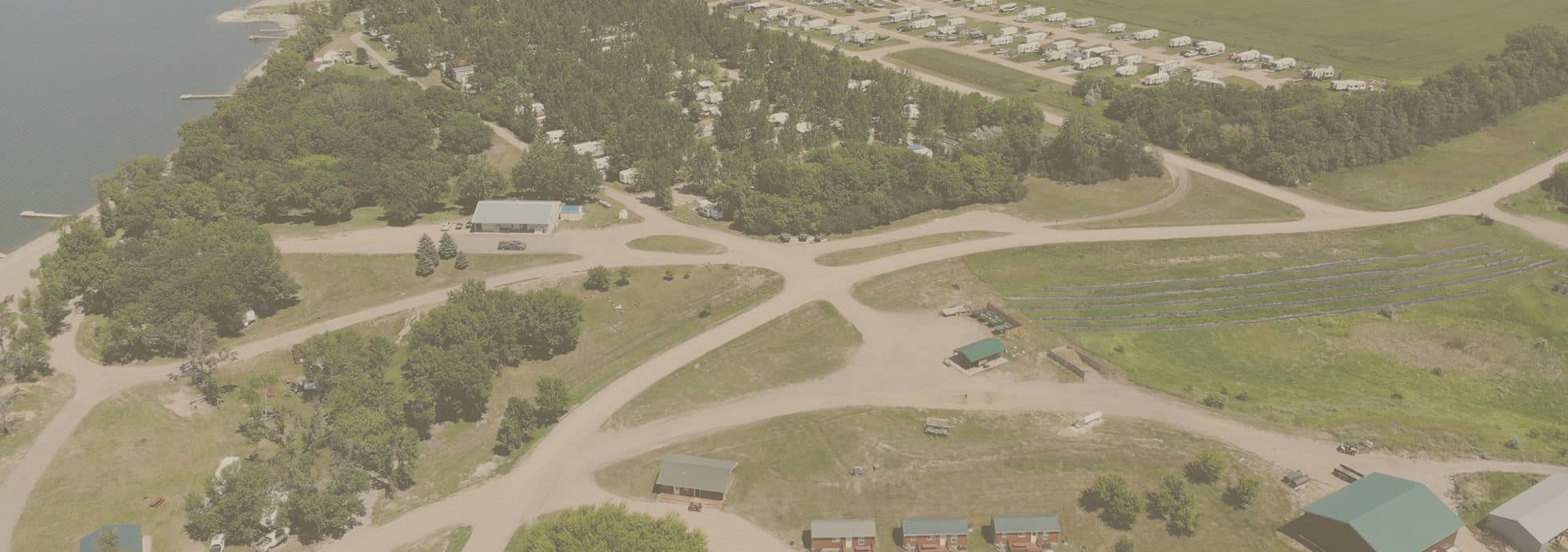 Overhead view of the buildings, campsites, lake and bait shop at Eastbay Campground.