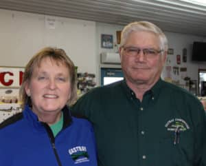 Valerie & Bill Wood wearing Eastbay Campground clothing hanging out in the bait shop at Eastbay Campground.
